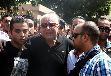 © APA Relatives cry as they attend the funeral of Egyptianswho were killed during clashes with supporters of ousted Egyptian President Mohamed Morsi, Egypt, 15 August 2013