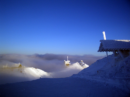 An alpine landscape above the clouds