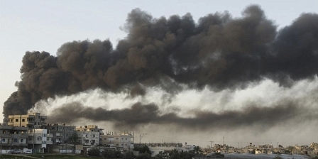 Smoke rises after an Israel air strike in Gaza Strip December 28, 2008. 