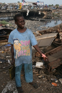 Boy collecting E-waste in Ghana