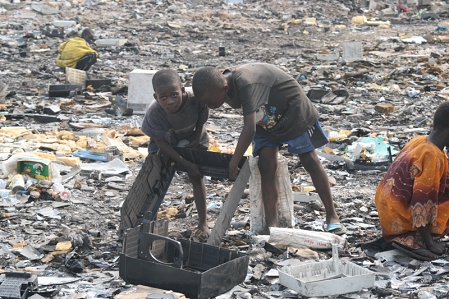 two boys collecting rubbish