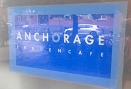 Schild des Frauencafè Anchorage