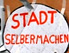 Schild mit Aufschrift: Stadt Selbermachen