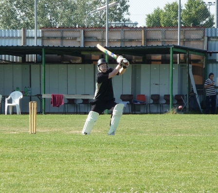 me hitting a cricket ball