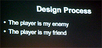 Eine Präsentations-Slide, auf dem "Design Process: The player is my enemy. The player is my friend" steht.