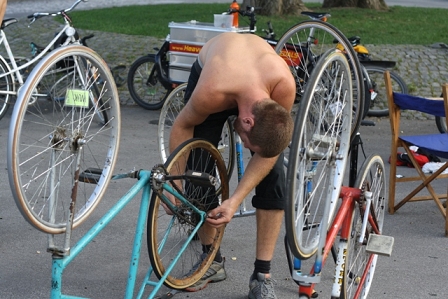 a bike baller fiddling with a bike