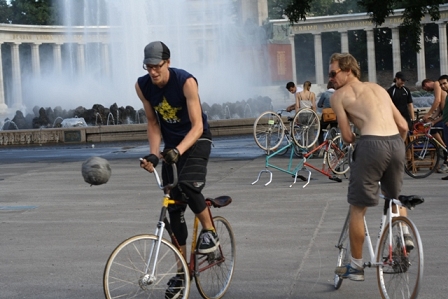 bike ball players grapple for the ball