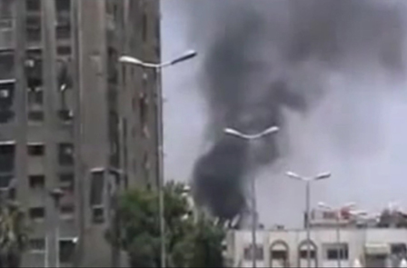 Smoke rising over al-Midan square during clashes in Damascus, Syria, 17 July 2012