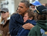 Obama comforting a victim of the hurrikan