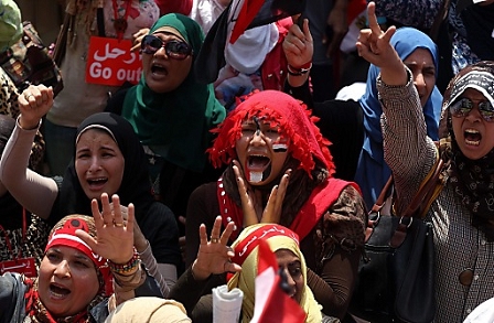 © apa Egyptian women shout slogans against the President Mohamed Morsi asking him to leave, during a protest in Tahrir Square, Cairo, Egypt, 03 July 2013.