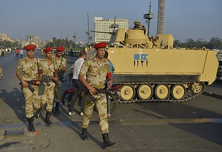 Troops patrol a bridge leading to Tahrir Square