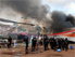 Egyptian security forces during the clearing of one of the two sit-ins of ousted president Morsi supporters, at Nahda square, near Cairo University (seen in background), Cairo, Egypt, 14 August 2013