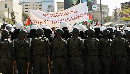 Palestinian security forces during a protest against peace negotiations