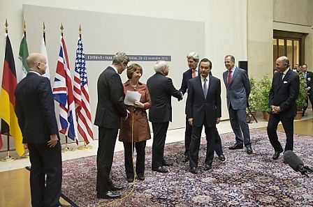 US Secretary of State John Kerry shaking hands with Iranian Foreign Minister Mohammad Javad Zarif  as European Union High Representative Catherine Ashtonand fellow P5+1 foreign ministers stand by