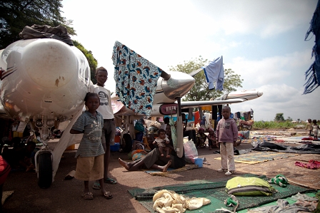 IDPs are seeking refuge from the rains under the wings of deranged airplanes next to M'poko Airport in Bangui.