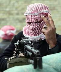 A Sunni fighter poses as he takes up position in Fallujah city, western Iraq, 05 January 2014