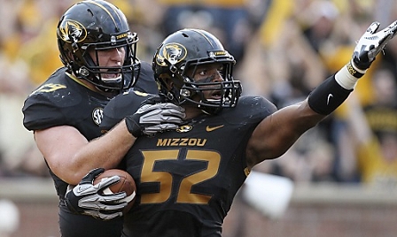 University of Missouri linebacker Michael Sam (R) is congratulated by teammate Matt Hoch (L) after a touchdown. 