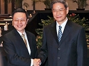 Wang Yu-chi, Minister of Taiwan's Mainland Affair Council, shakes hands with Zhang Zhijun, Minister of China's Taiwan Affairs Office