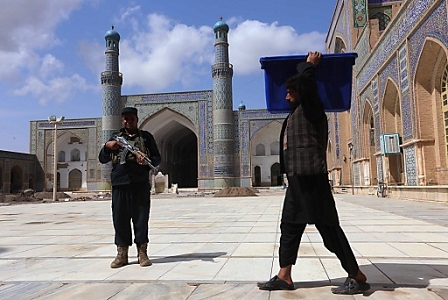  Afghan workers of the Independent Election Commission transport electoral materials to a polling station at Blue Mosque, on the eve of Presidential elections, in Herat, Afghanistan, 04 April 2014