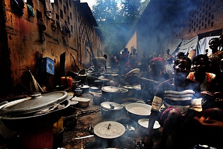 A handout picture made available by Medecins Sans Frontieres (MSF) shows refugees cooking food at a refugee camp in Bossangoa, Central African Republic.