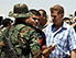 Iraqis fleeing from Mosul queue at a checkpoint to get into the region of Kurdistan