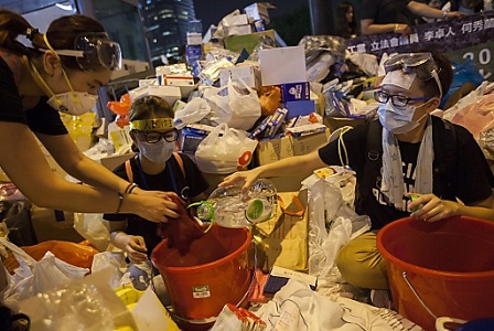 Occupy Central pro-democracy protesters wet cloths for distribution in preparation for tear gas 