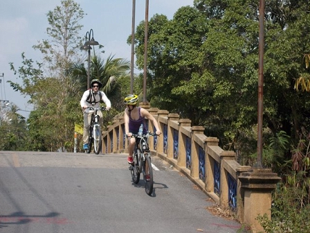 Cycling over a bridge in Bangkok