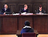 An image of the accused teenager in court before the start of the trial.