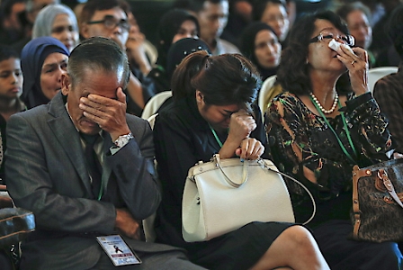 Relatives of the victims of the MH17 passenger plane crash react during the Malaysia Airlines MH17 First Year Memorial Ceremony, in Kompleks Bunga Raya, Sepang, Malaysia.